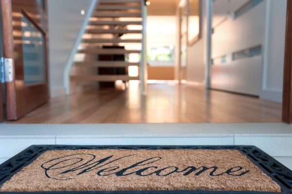 Close Up Of A Welcome Mat In An Inviting House Close Up Of A Welcome Mat In An Inviting House