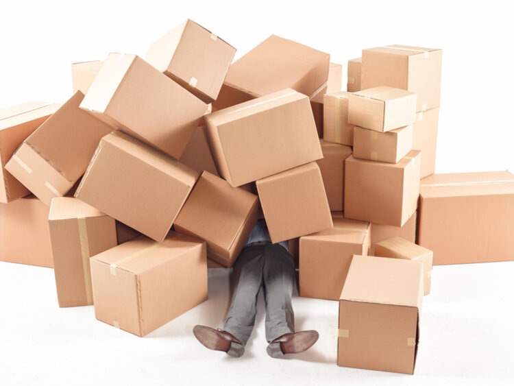 Man Stuck Under The With Boxes