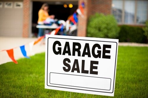 Garage Sale Sign With Woman Shopping