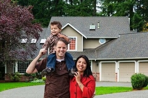 Young Mixed Race Family Of Three At Home